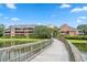 Exterior view of building and waterfront walkway at 410 Melrose Pl. # 309, Myrtle Beach, SC 29572