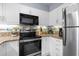 Modern kitchen with stainless steel appliances and granite countertops at 410 Melrose Pl. # 309, Myrtle Beach, SC 29572