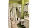 Bathroom with tub, toilet, and built-in shelving at 217 Egret Run Ln. # 914, Pawleys Island, SC 29585