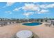 Community pool with lounge chairs and patio at 8862 Cloister Dr. # F, Myrtle Beach, SC 29575