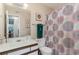 Neat bathroom with updated vanity, toilet, and patterned shower curtain at 8862 Cloister Dr. # F, Myrtle Beach, SC 29575