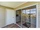 Screened porch with sliding glass doors and pond view at 8862 Cloister Dr. # F, Myrtle Beach, SC 29575