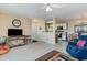 Open living room with partial kitchen view, comfy seating and balcony access at 8862 Cloister Dr. # F, Myrtle Beach, SC 29575