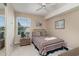 Cozy bedroom with striped bedding, nightstand, and mirrored closet at 8862 Cloister Dr. # F, Myrtle Beach, SC 29575