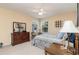Comfortable bedroom with wood dresser, full bed, and neutral decor at 8862 Cloister Dr. # F, Myrtle Beach, SC 29575