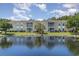 Two tan buildings with screened porches on a pond at 8862 Cloister Dr. # F, Myrtle Beach, SC 29575