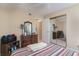 Bright bedroom with striped bedding, dresser, and mirrored closet at 8862 Cloister Dr. # F, Myrtle Beach, SC 29575