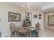 Bright dining area with glass-top table and four chairs, near kitchen at 8862 Cloister Dr. # F, Myrtle Beach, SC 29575