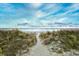 Sandy path to the beach with dune vegetation at 5801 Oyster Catcher Dr. # 434, North Myrtle Beach, SC 29582