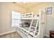 Bedroom with a bunk bed, window, and a small closet at 5801 Oyster Catcher Dr. # 434, North Myrtle Beach, SC 29582
