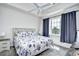 King-size bedroom with ceiling fan and gray curtains at 5801 Oyster Catcher Dr. # 434, North Myrtle Beach, SC 29582