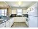 Simple kitchen with white cabinets and granite countertops at 5801 Oyster Catcher Dr. # 434, North Myrtle Beach, SC 29582