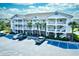 Three-story building exterior with parking at 5801 Oyster Catcher Dr. # 434, North Myrtle Beach, SC 29582