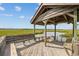 Wooden gazebo with seating on a calm marsh at 496 Myrtle Ave., Pawleys Island, SC 29585