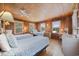 Charming bedroom with twin beds, hardwood floors, and wood-paneled walls at 496 Myrtle Ave., Pawleys Island, SC 29585