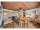 Bright dining room with a rustic wooden table and colorful chairs at 496 Myrtle Ave., Pawleys Island, SC 29585