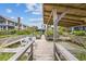 Relaxing wooden deck overlooking the marsh with seating and a hammock at 496 Myrtle Ave., Pawleys Island, SC 29585