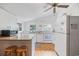 Bright kitchen features granite countertops, white appliances, and wood-look flooring at 496 Myrtle Ave., Pawleys Island, SC 29585
