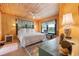 Relaxing bedroom with a king-size bed, wood floors, and a view at 496 Myrtle Ave., Pawleys Island, SC 29585