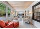Bright sunroom with comfortable seating and a view of the garden at 496 Myrtle Ave., Pawleys Island, SC 29585