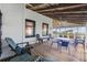 Relaxing screened porch with seating and ocean views at 496 Myrtle Ave., Pawleys Island, SC 29585