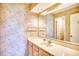 Bathroom with pedestal sink, shower/tub combo, and patterned wallpaper at 4103 Pinehurst Circle # Bb-12, Little River, SC 29566