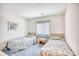 Bedroom with two twin beds, nightstand, and window at 4103 Pinehurst Circle # Bb-12, Little River, SC 29566