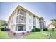 Building exterior showcasing multiple balconies and landscaping at 4103 Pinehurst Circle # Bb-12, Little River, SC 29566