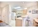 Efficient kitchen with white appliances and light wood cabinets at 4103 Pinehurst Circle # Bb-12, Little River, SC 29566