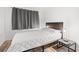 Cozy bedroom with a comfortable bed and nightstand at 7509 N Ocean Blvd. # 103, Myrtle Beach, SC 29572