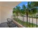 Private balcony with two chairs and scenic neighborhood view at 7509 N Ocean Blvd. # 103, Myrtle Beach, SC 29572