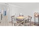 Charming dining area with rustic wooden table and four chairs at 7509 N Ocean Blvd. # 103, Myrtle Beach, SC 29572