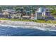 Aerial view showing oceanfront condo building near beach at 7509 N Ocean Blvd. # 103, Myrtle Beach, SC 29572