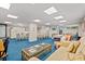 Spacious community room with comfortable seating and dining area at 7509 N Ocean Blvd. # 103, Myrtle Beach, SC 29572