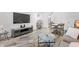 Spacious living room with comfy seating and large TV at 7509 N Ocean Blvd. # 103, Myrtle Beach, SC 29572
