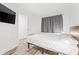 Clean and spacious bedroom with wood flooring and large window at 7509 N Ocean Blvd. # 103, Myrtle Beach, SC 29572