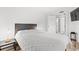 Well-lit bedroom with a double bed and ensuite bathroom access at 7509 N Ocean Blvd. # 103, Myrtle Beach, SC 29572