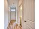 Hallway with wood-style flooring, entryway, and half bathroom at 4723 Huckleberry Ln., Conway, SC 29526