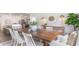 Spacious dining area with farmhouse table and view into kitchen at 201 Hadley Springs Ave, Longs, SC 29568