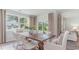 Bright dining room with wooden table and chairs, and access to backyard at 201 Hadley Springs Ave, Longs, SC 29568