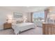Spacious bedroom with large window, plush bedding, and neutral decor at 201 Hadley Springs Ave, Longs, SC 29568