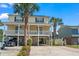 Two-story house with a parking area underneath at 213 South Myrtle Dr., Surfside Beach, SC 29575