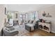 Open living room with grey sectional sofa and kitchen access at 5601 N Ocean Blvd. # 315-C, Myrtle Beach, SC 29577