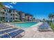 Community pool with plenty of lounge chairs at 5601 N Ocean Blvd. # 315-C, Myrtle Beach, SC 29577