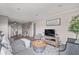 Open living room with grey sectional sofa and kitchen access at 5601 N Ocean Blvd. # 315-C, Myrtle Beach, SC 29577