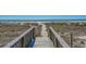 Beach access walkway leading to the sandy beach at 5601 N Ocean Blvd. # 315-C, Myrtle Beach, SC 29577