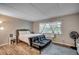 Bright bedroom with hardwood floors, a queen-size bed, and a sofa at 6850 Blue Heron Blvd. # 406, Myrtle Beach, SC 29588