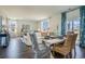 Bright dining room with a white table and wicker chairs, overlooking the backyard at 545 Black Pearl Way, Myrtle Beach, SC 29588