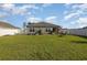 Spacious backyard with grassy lawn and raised garden beds at 197 Golden Bear Circle, Longs, SC 29568