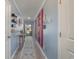 Inviting hallway showcasing a gallery wall and decorative rug at 197 Golden Bear Circle, Longs, SC 29568